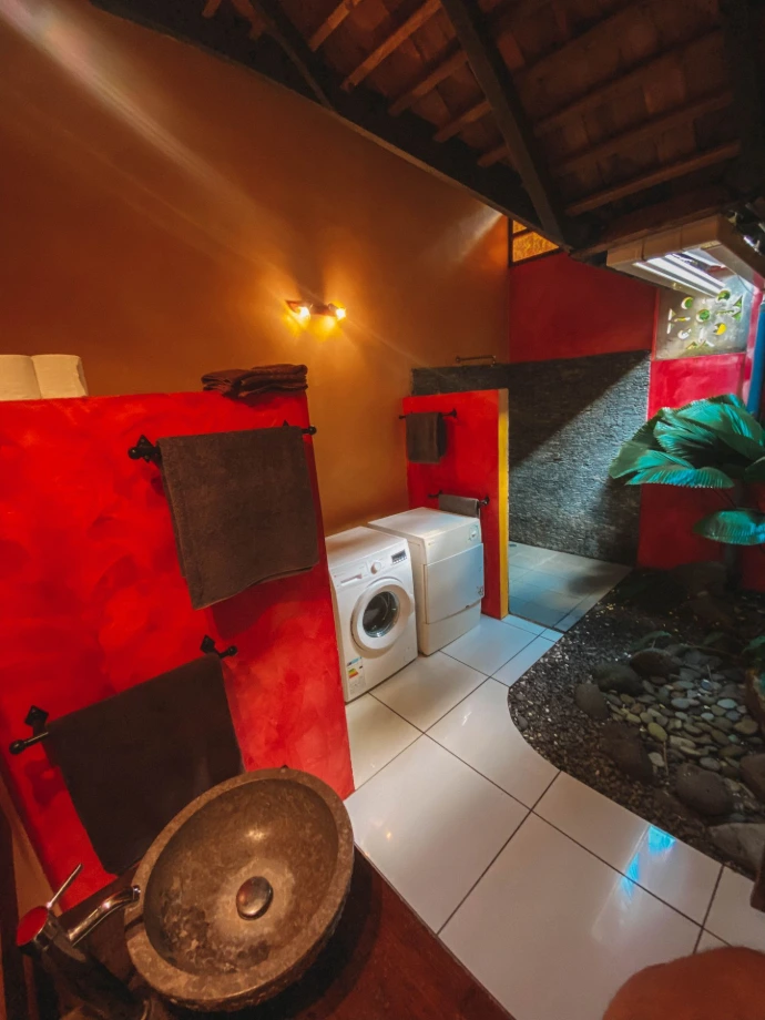 En-suite bathroom with natural stone finishes at Villa Hotu