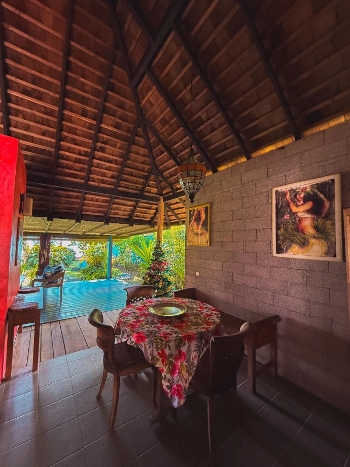 Open-plan living and dining area inside Villa Hotu, Balinese design