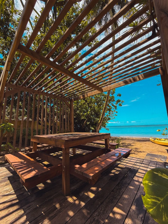 Terrace with dining table and ocean view at Villa Tamanu, Villa Mitirapa
